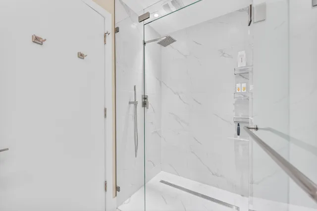 a bathroom with a bathtub and shower