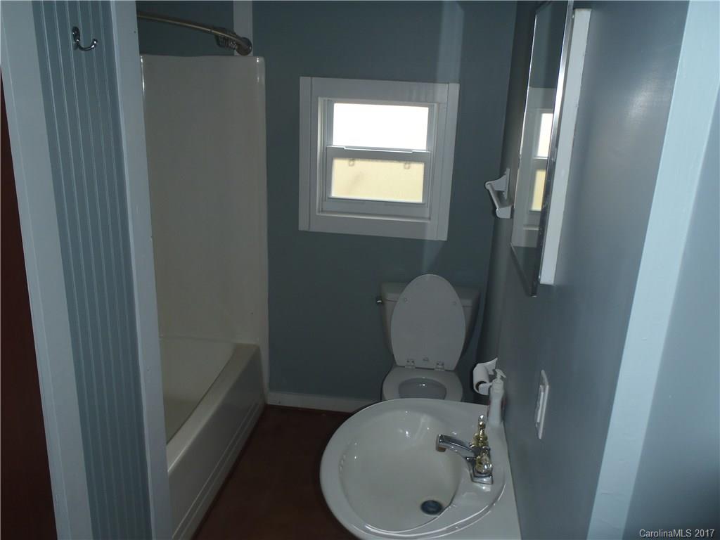 a bathroom with a toilet and a sink