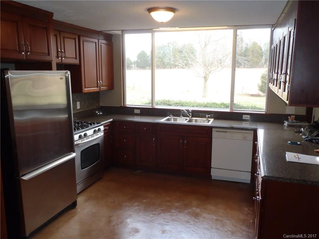 0 Hewitt Road Cleveland, NC 27013 - Photo 2 of 3 a kitchen with a sink stove and refrigerator