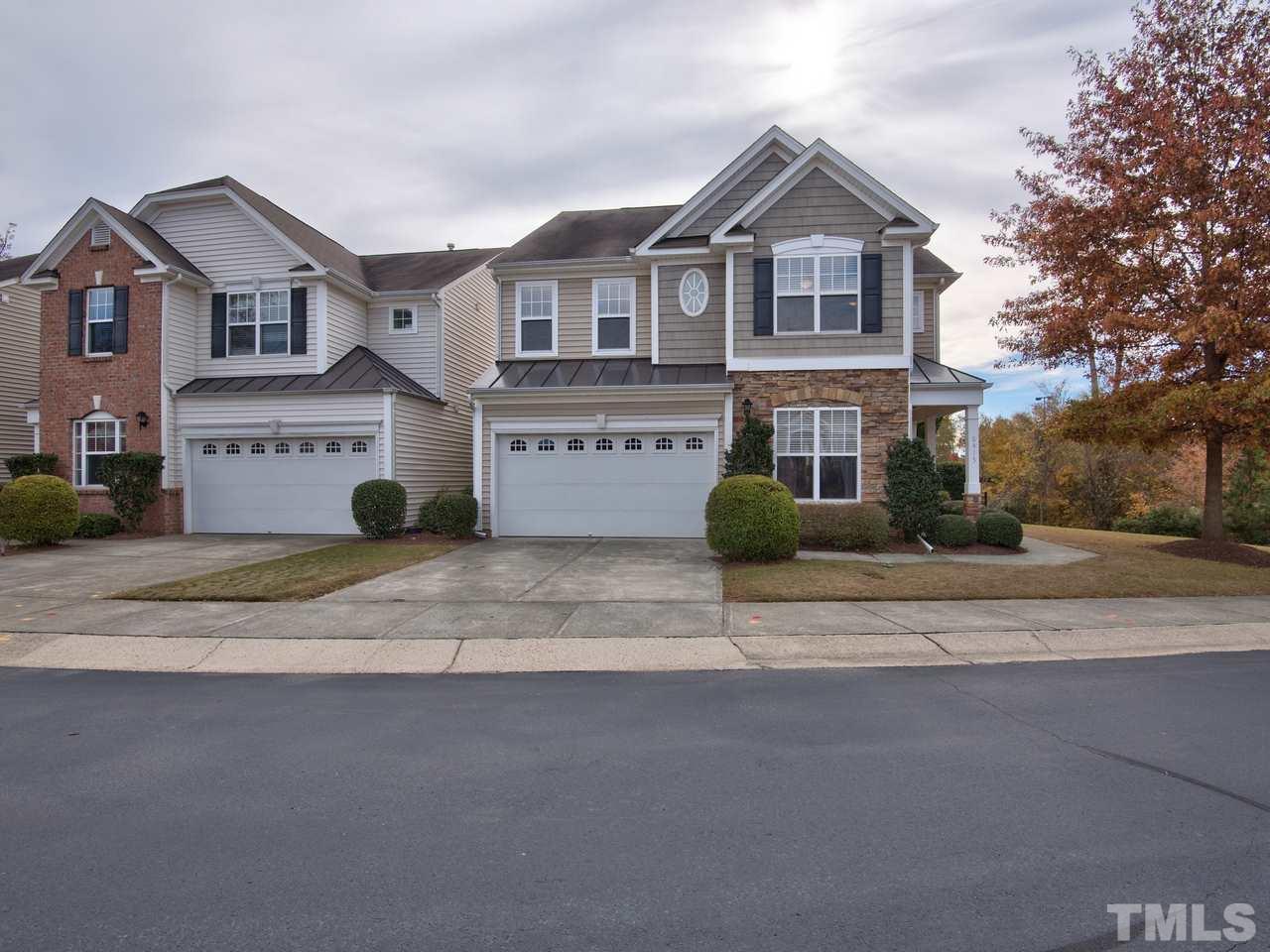 8415 Stonework Drive Raleigh, NC 27613 - Photo 1 of 24 a front view of a house with a yard