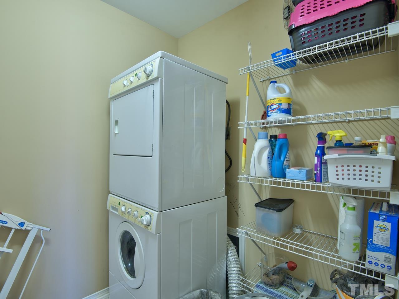 8415 Stonework Drive Raleigh, NC 27613 - Photo 18 of 24 a utility room with dryer and washer