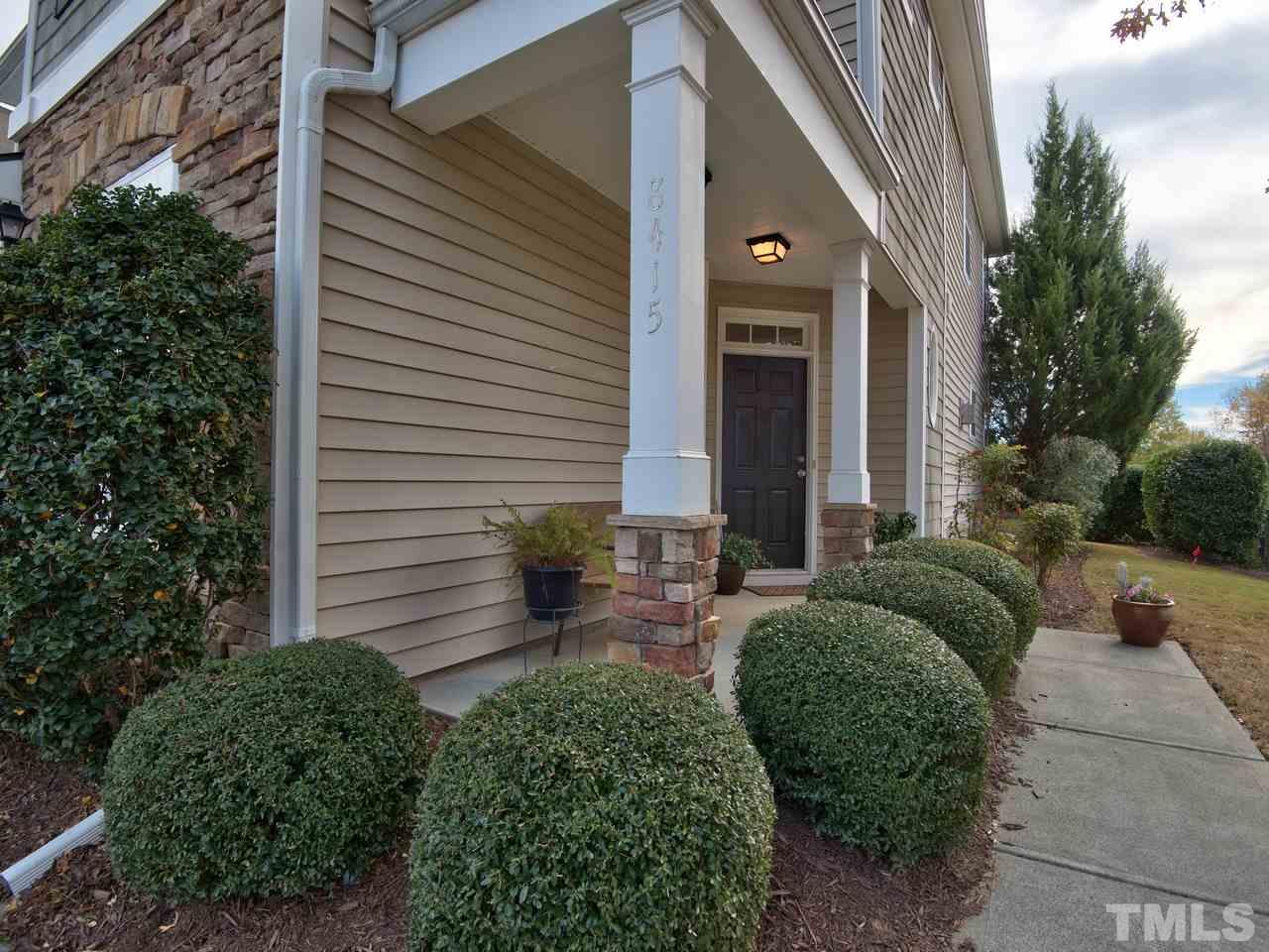 8415 Stonework Drive Raleigh, NC 27613 - Photo 3 of 24 a view of a house with a small yard and plants