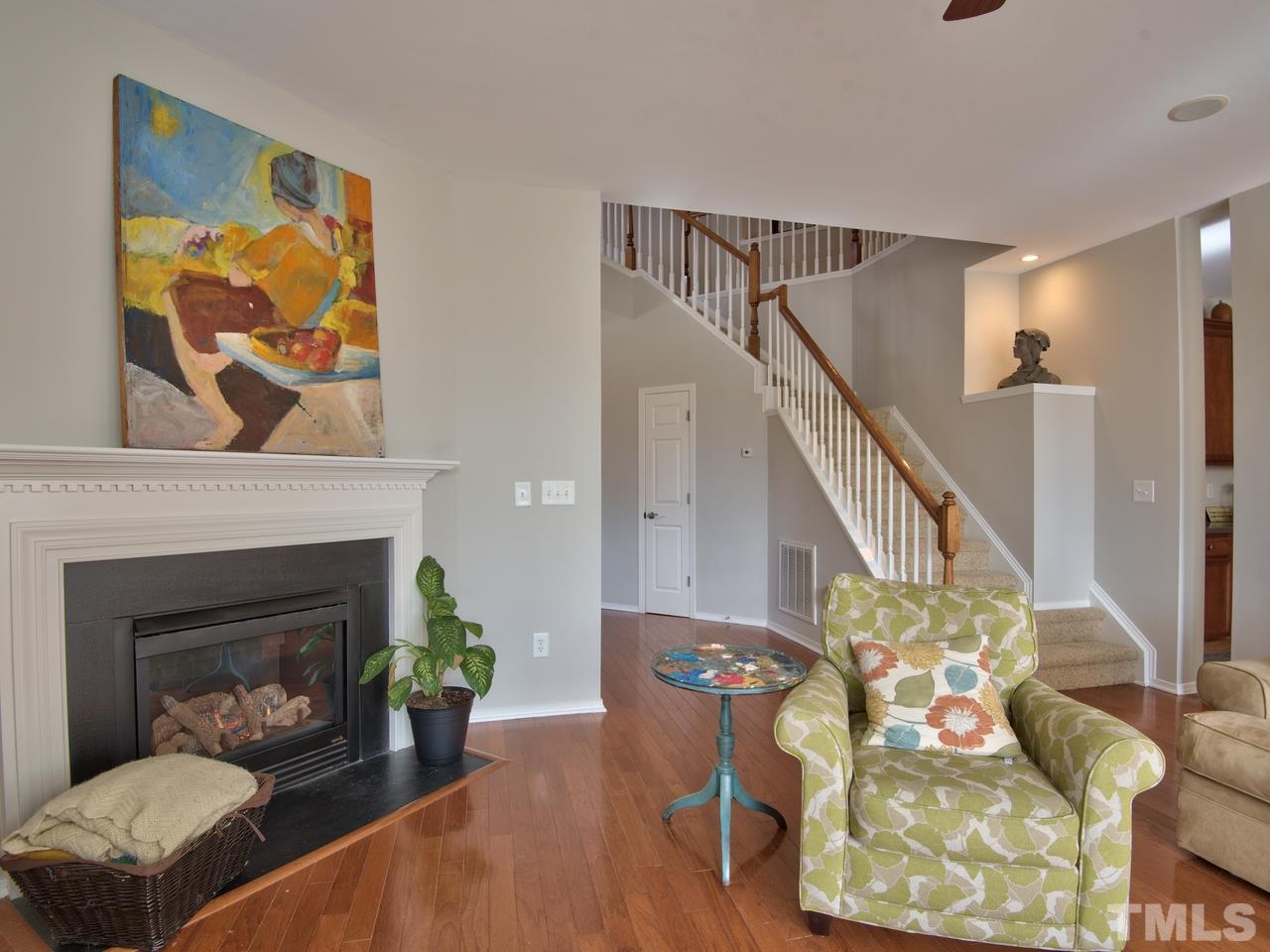8415 Stonework Drive Raleigh, NC 27613 - Photo 6 of 24 a living room with furniture and a fireplace