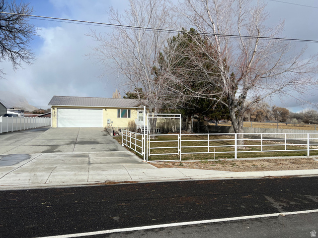 640 West Cyn Road Ferron, UT 84523 - Photo 3 of 45 View of front facade with a fenced front yard and concrete driveway