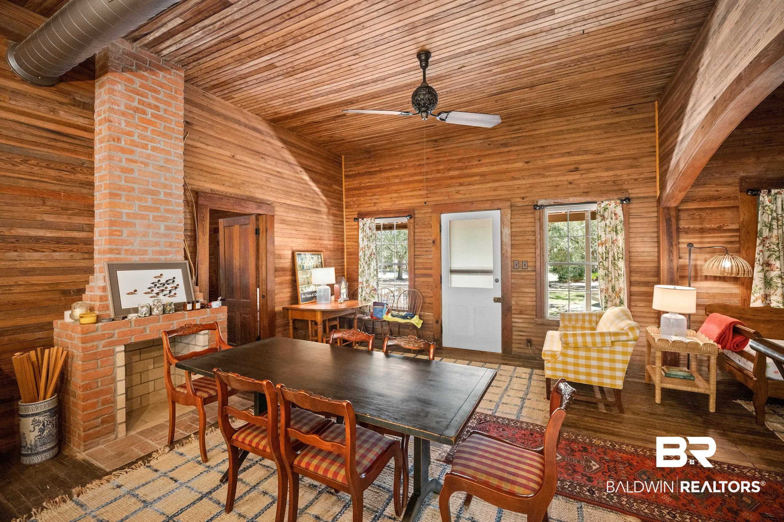 30671 Magnolia Street Elberta, AL 36530 - Photo 18 of 68 Dining space with a high ceiling, wood ceiling, wooden walls, and ceiling fan
