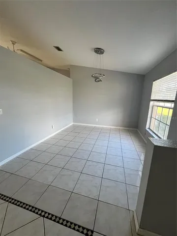 a view of an empty room and window