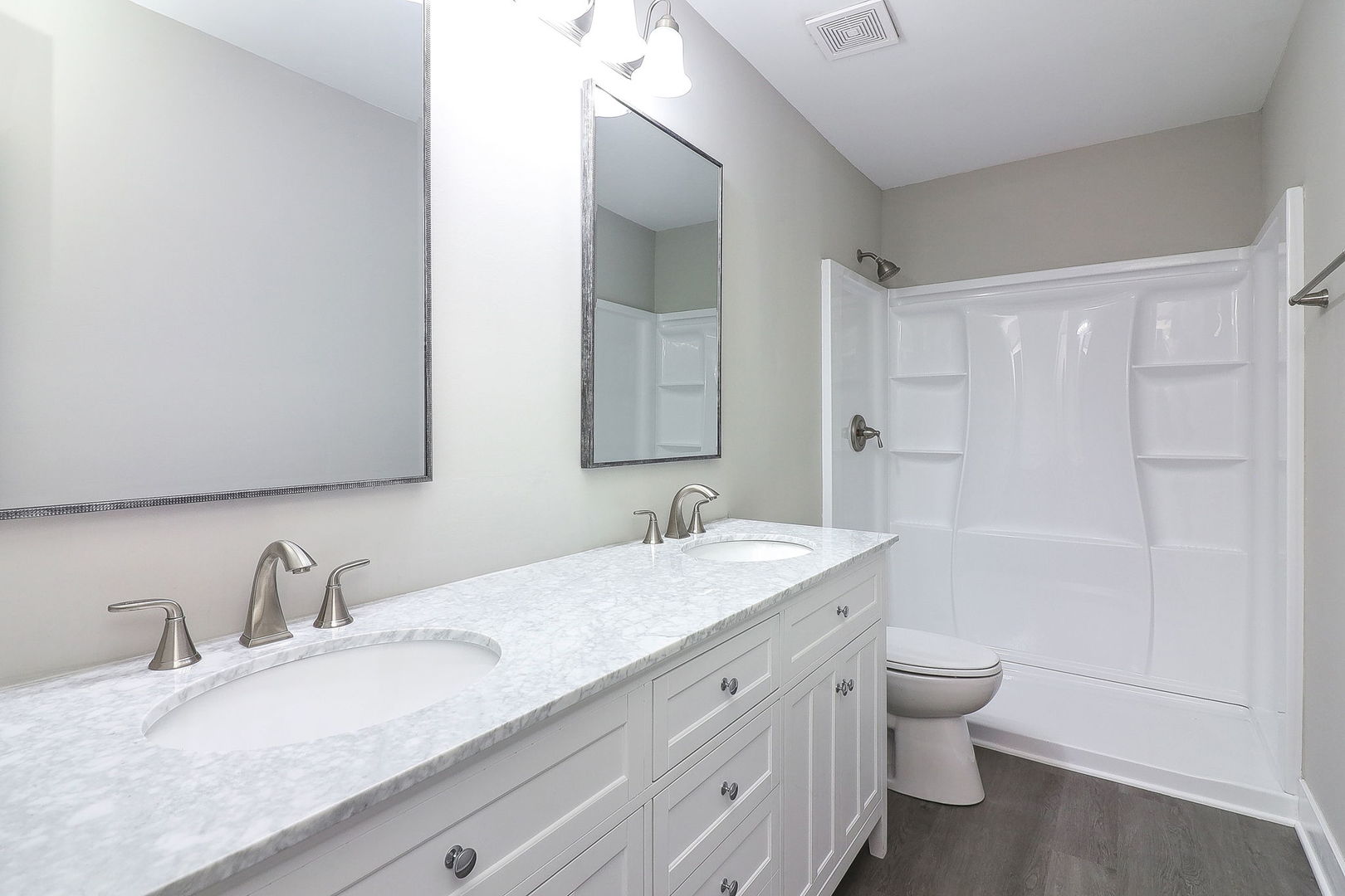 1914 Brookside Lane Hoffman Estates, IL 60169 - Photo 12 of 16 a bathroom with a granite countertop sink mirror vanity and toilet