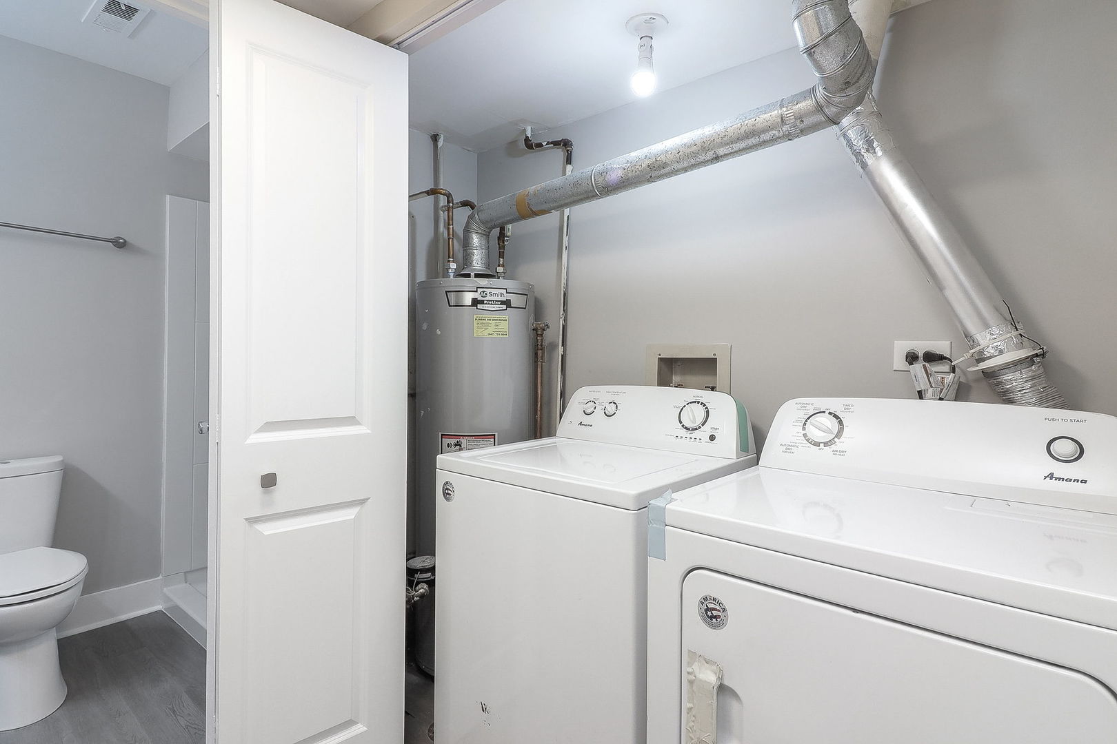 1914 Brookside Lane Hoffman Estates, IL 60169 - Photo 14 of 16 a view of bathroom with a washer and dryer