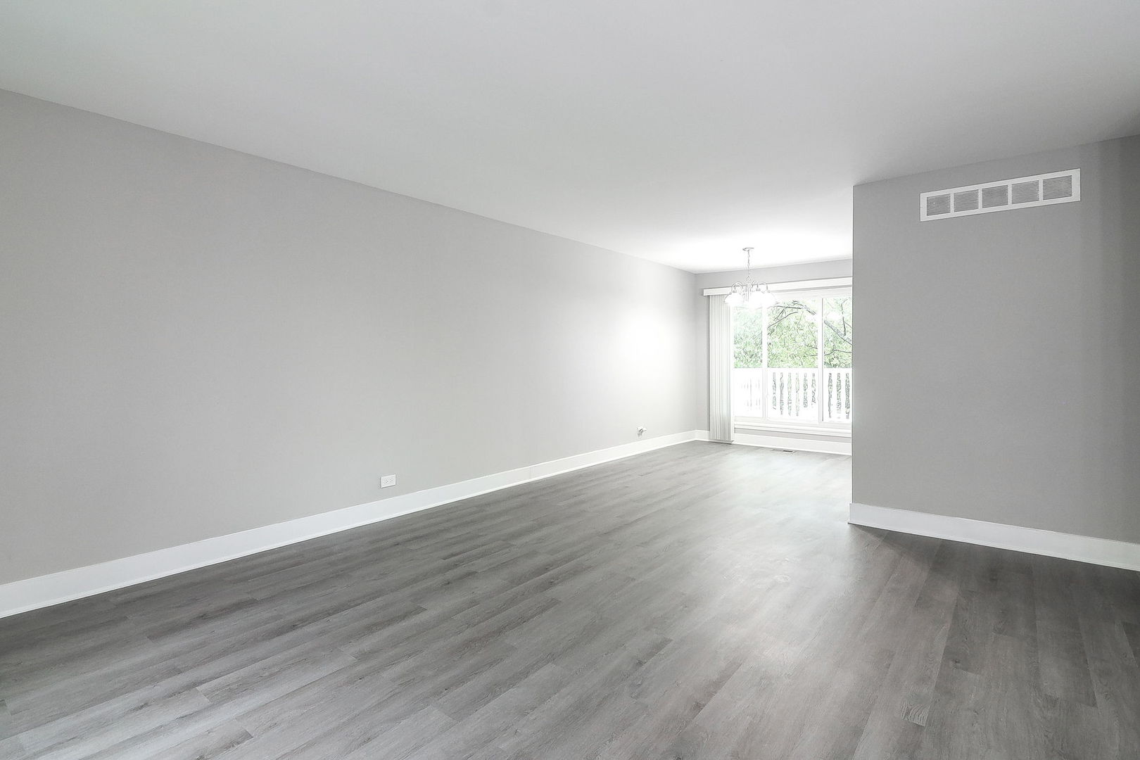 1914 Brookside Lane Hoffman Estates, IL 60169 - Photo 4 of 16 a view of an empty room with wooden floor and window