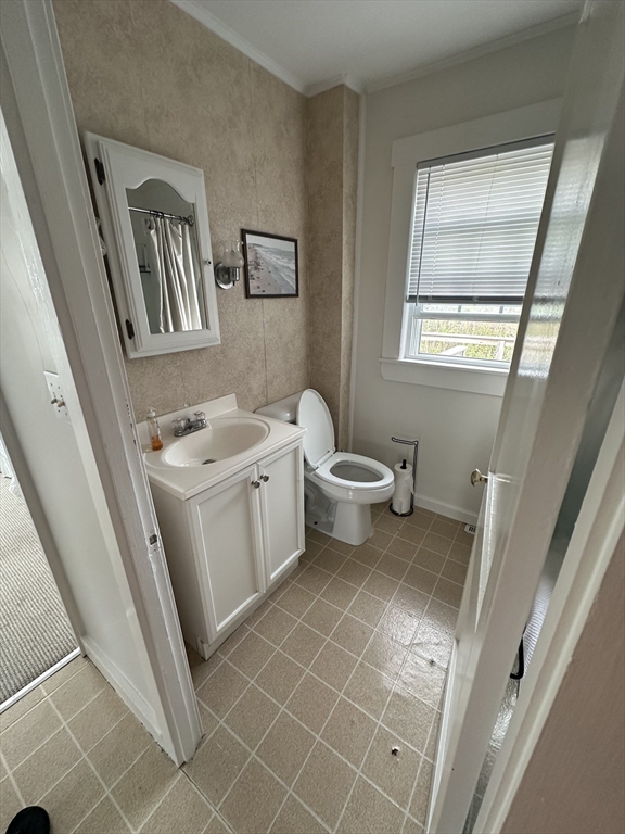 21 Stone Avenue Scituate, MA 02066 - Photo 18 of 20 a bathroom with a toilet sink and mirror