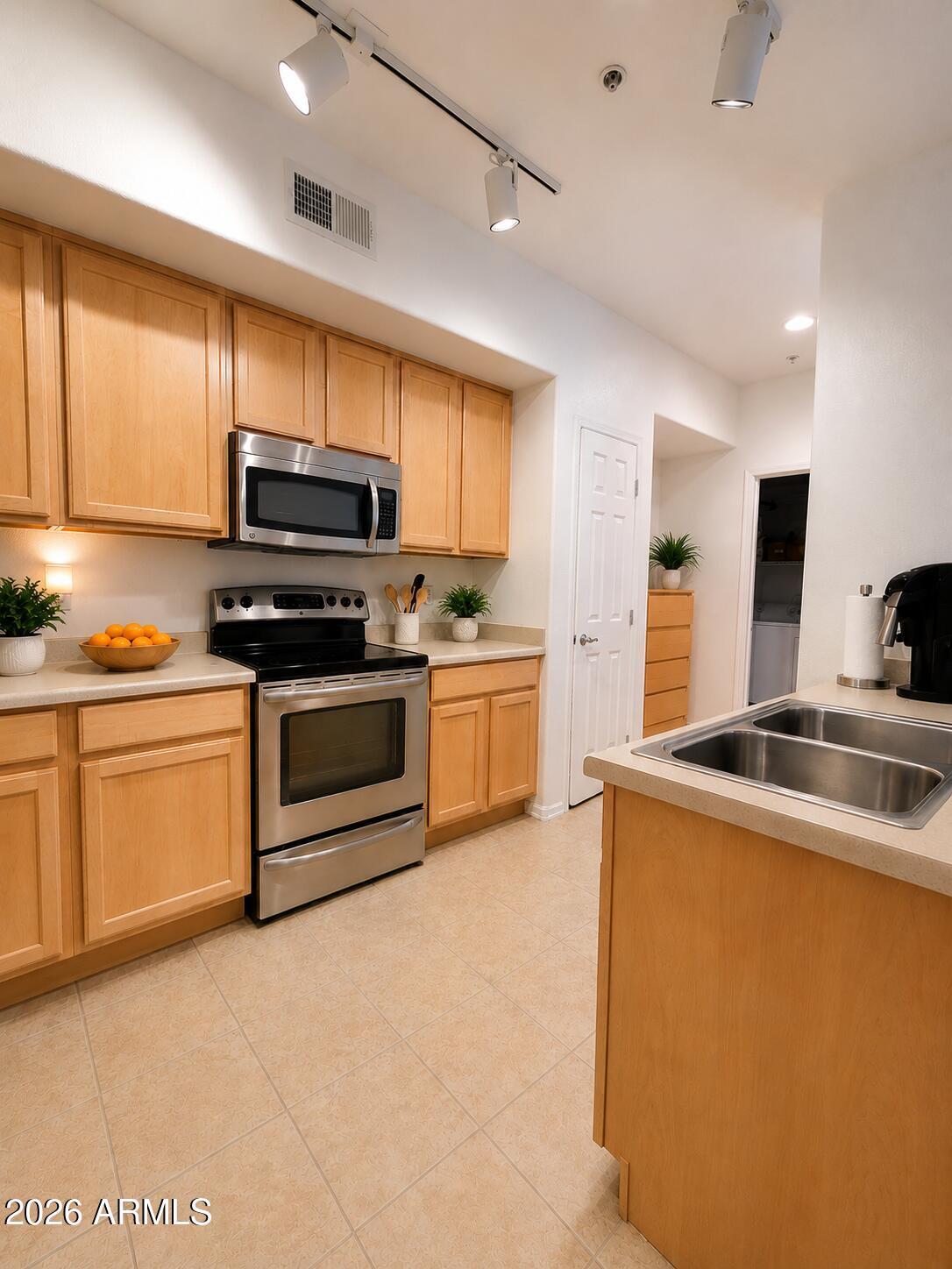 2150 West Alameda Road, Unit 1020 Phoenix, AZ 85085 - Photo 18 of 35 a kitchen with a sink a stove and cabinets