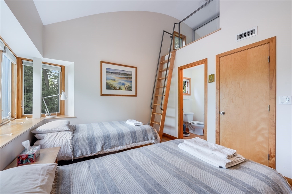 22 Decatur Street, Unit 20 Cambridge, MA 02139 - Photo 13 of 22 a bedroom with a bed and a window