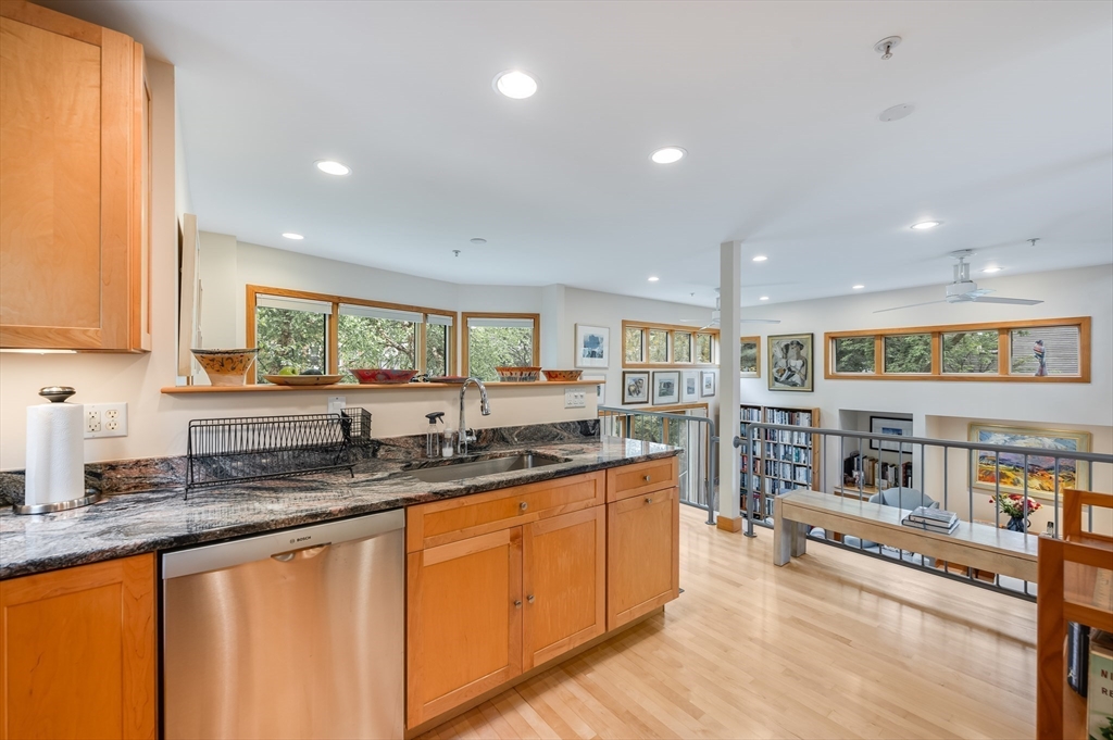 22 Decatur Street, Unit 20 Cambridge, MA 02139 - Photo 5 of 22 a kitchen with stainless steel appliances granite countertop a sink and cabinets
