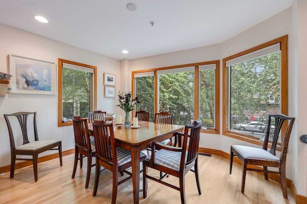 22 Decatur Street, Unit 20 Cambridge, MA 02139 - Photo 6 of 22 a dining room with furniture a rug and a large window