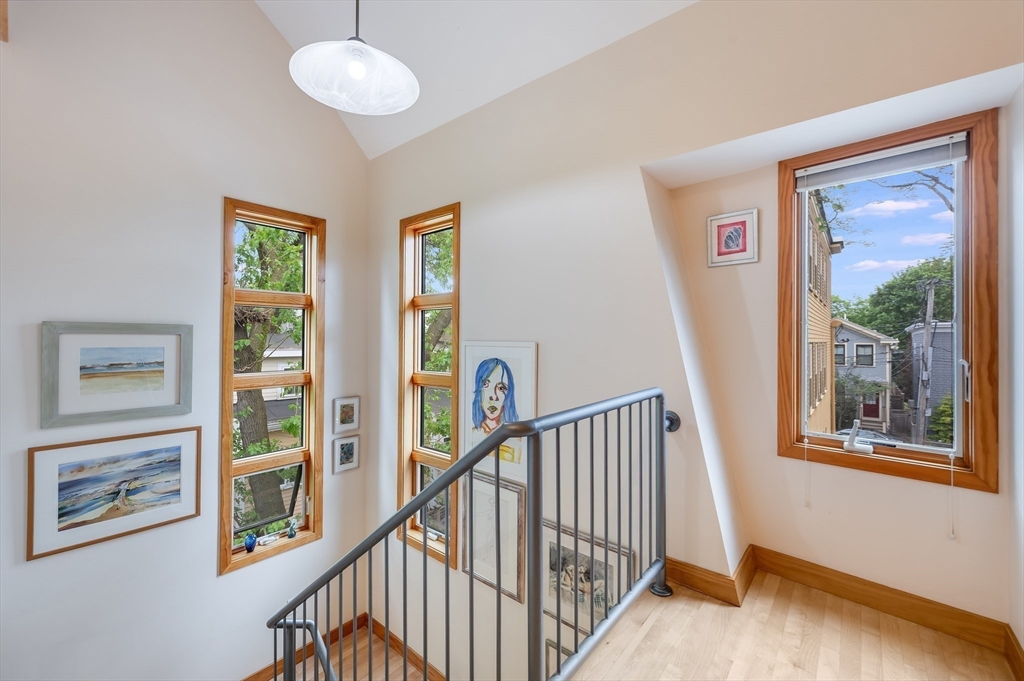 22 Decatur Street, Unit 20 Cambridge, MA 02139 - Photo 8 of 22 a view of a hallway with wooden floor and windows