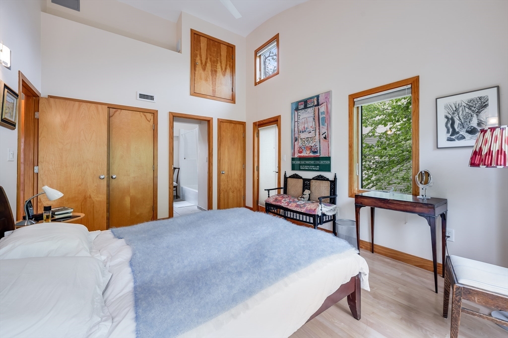 22 Decatur Street, Unit 20 Cambridge, MA 02139 - Photo 10 of 22 a bedroom with a large bed and a large window