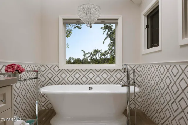 a view of washer and dryer with kitchen in the background