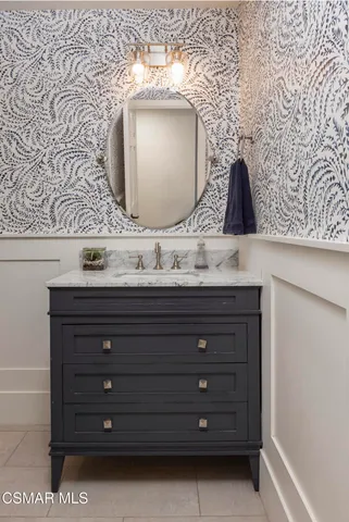 a view of a backyard with table and chairs under an umbrella
