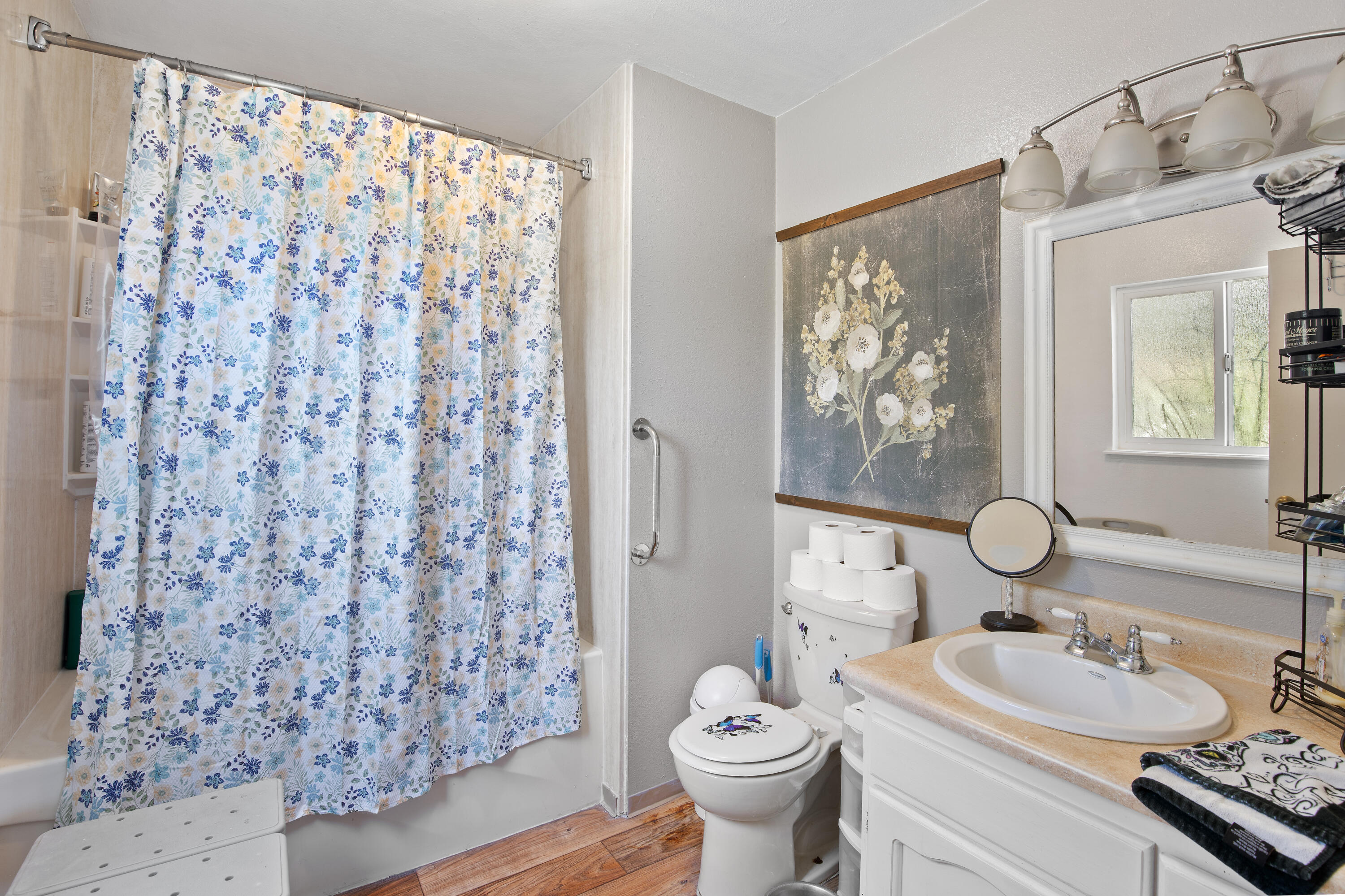 12748 Water Gap Road Williams, OR 97544 - Photo 14 of 35 a bathroom with a double vanity sink toilet mirror and shower