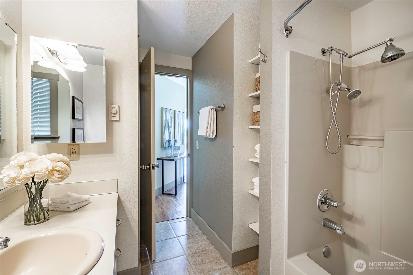 5537 Salish Road Blaine, WA 98230 - Photo 11 of 39 a bathroom with a sink vanity granite shower and a mirror