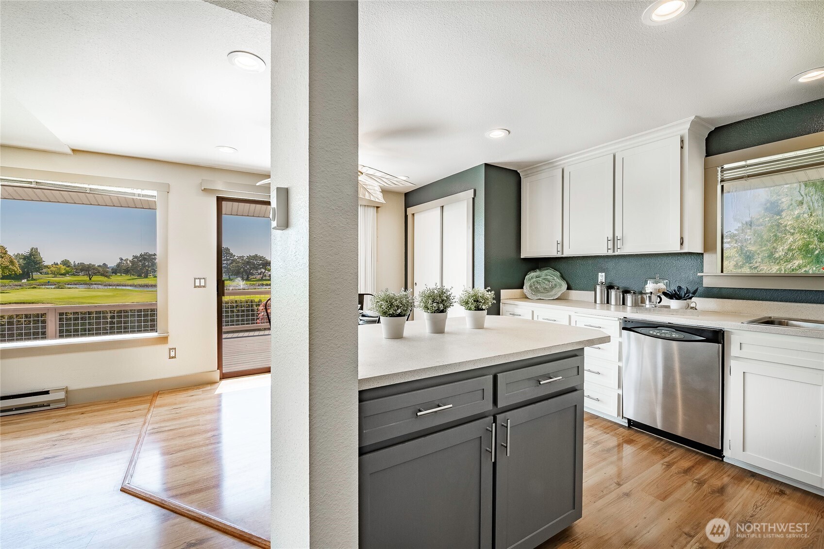 5537 Salish Road Blaine, WA 98230 - Photo 15 of 39 a kitchen with a sink stove and cabinets