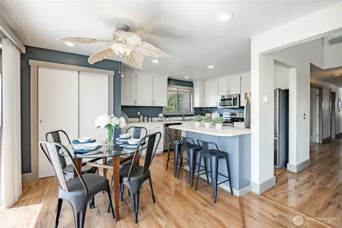 a view of a dining room with furniture and wooden floor