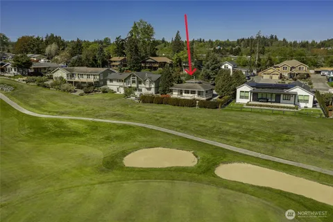 a view of a water with a big yard