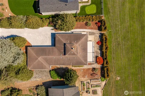 an aerial view of a house with outdoor space
