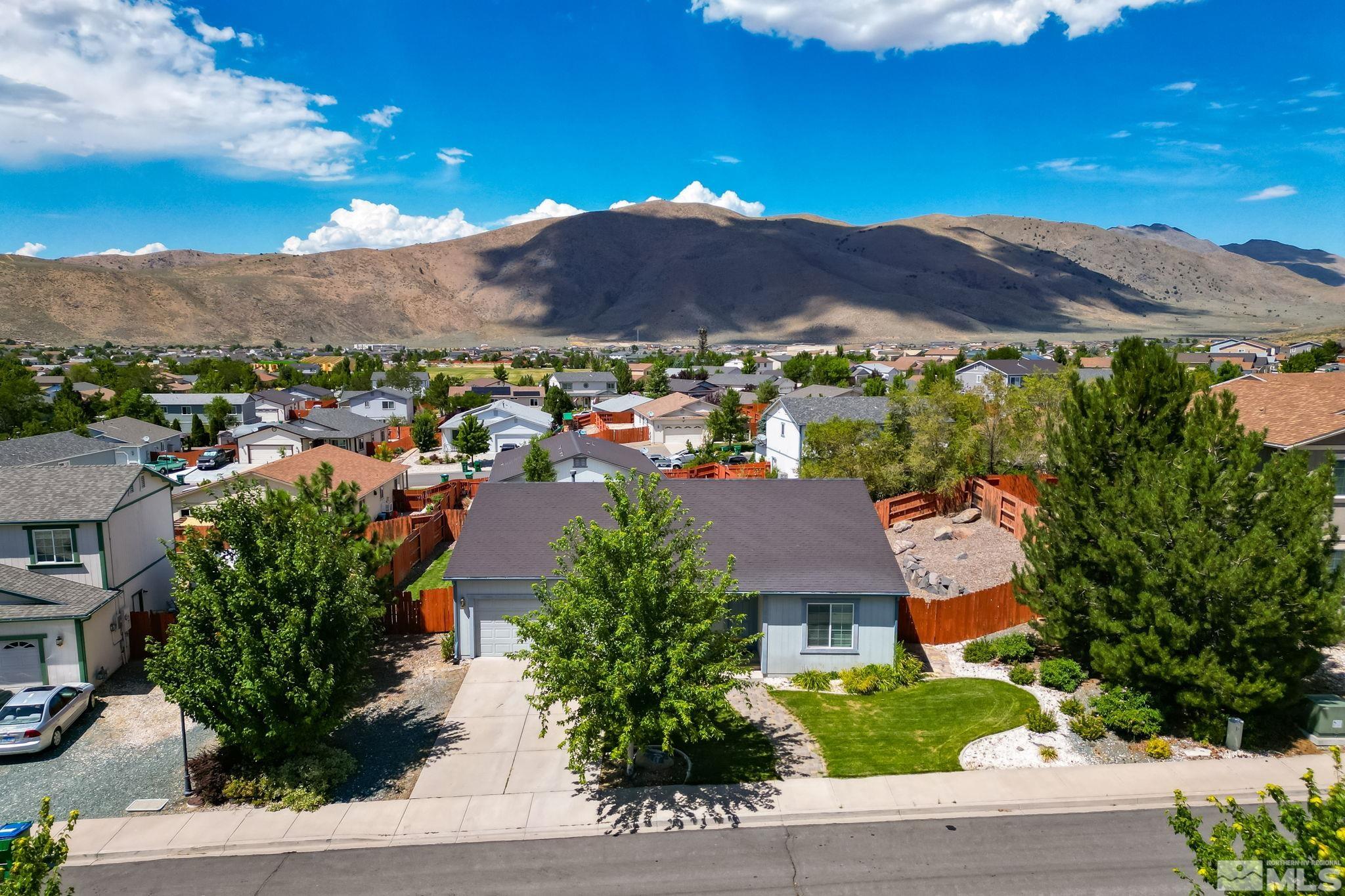 17541 Desert Lake Drive Reno, NV 89508 - Photo 1 of 33 an aerial view of residential houses and trees