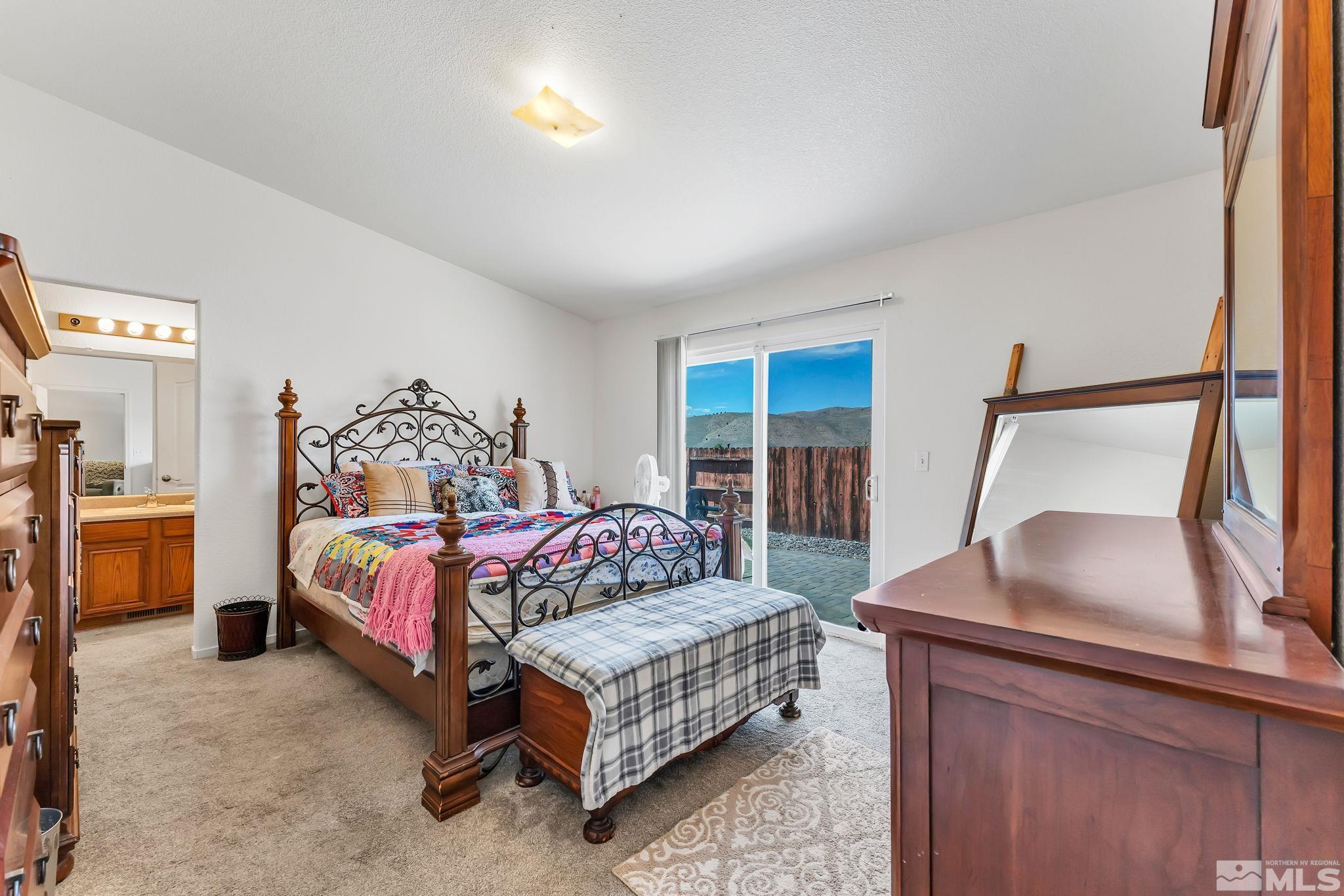 17541 Desert Lake Drive Reno, NV 89508 - Photo 17 of 33 a bedroom with a bed and a dresser