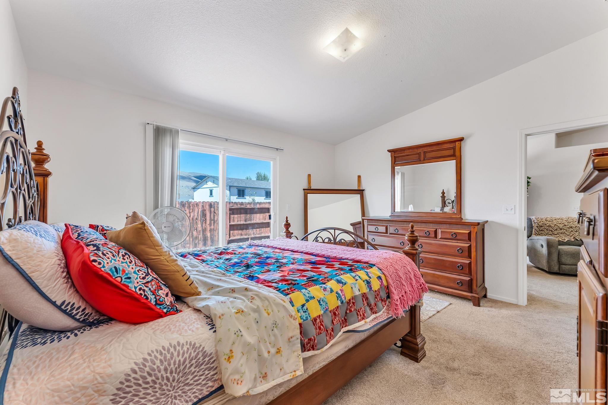 17541 Desert Lake Drive Reno, NV 89508 - Photo 18 of 33 a bedroom with bed and window