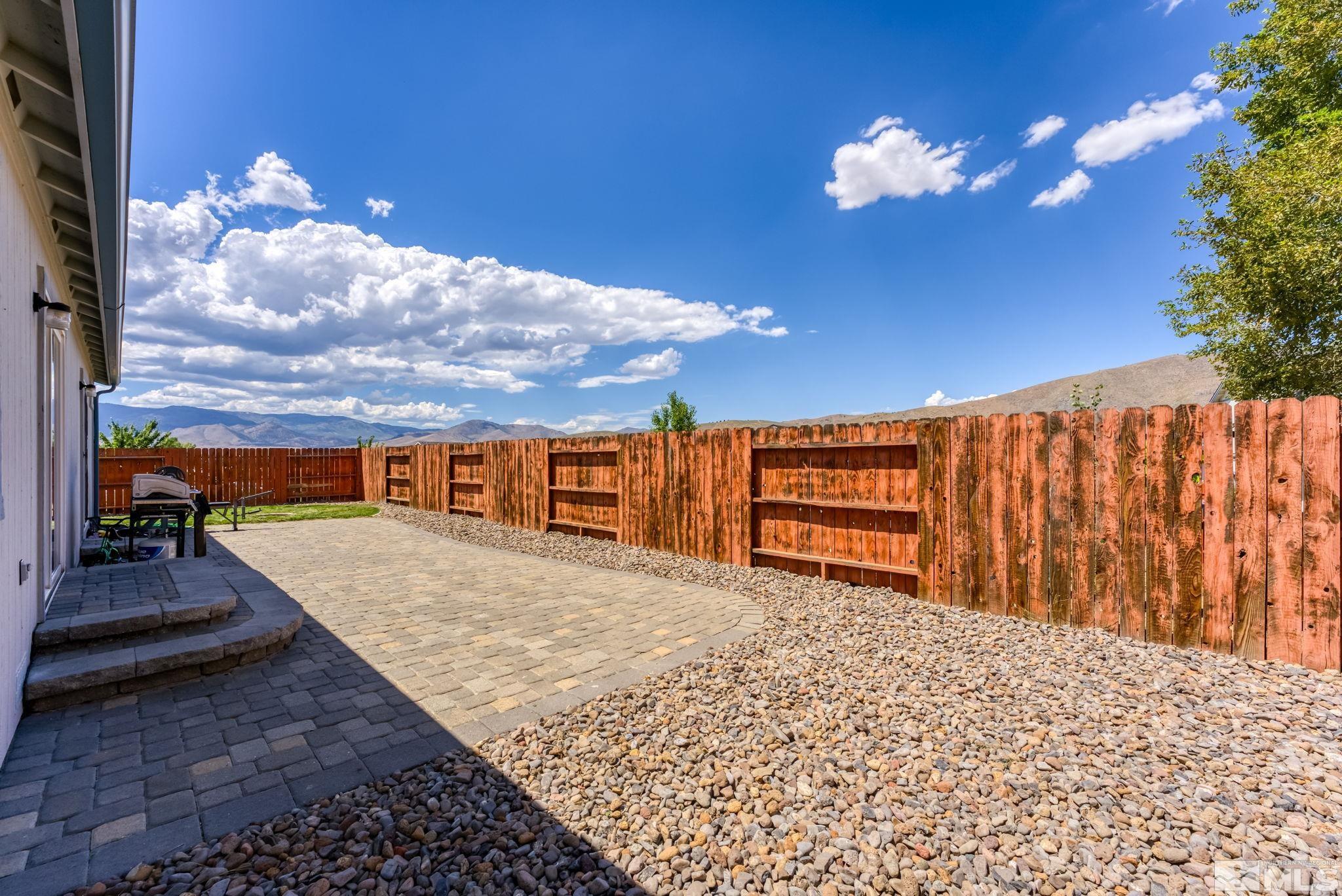 17541 Desert Lake Drive Reno, NV 89508 - Photo 24 of 33 a view of a house with a backyard