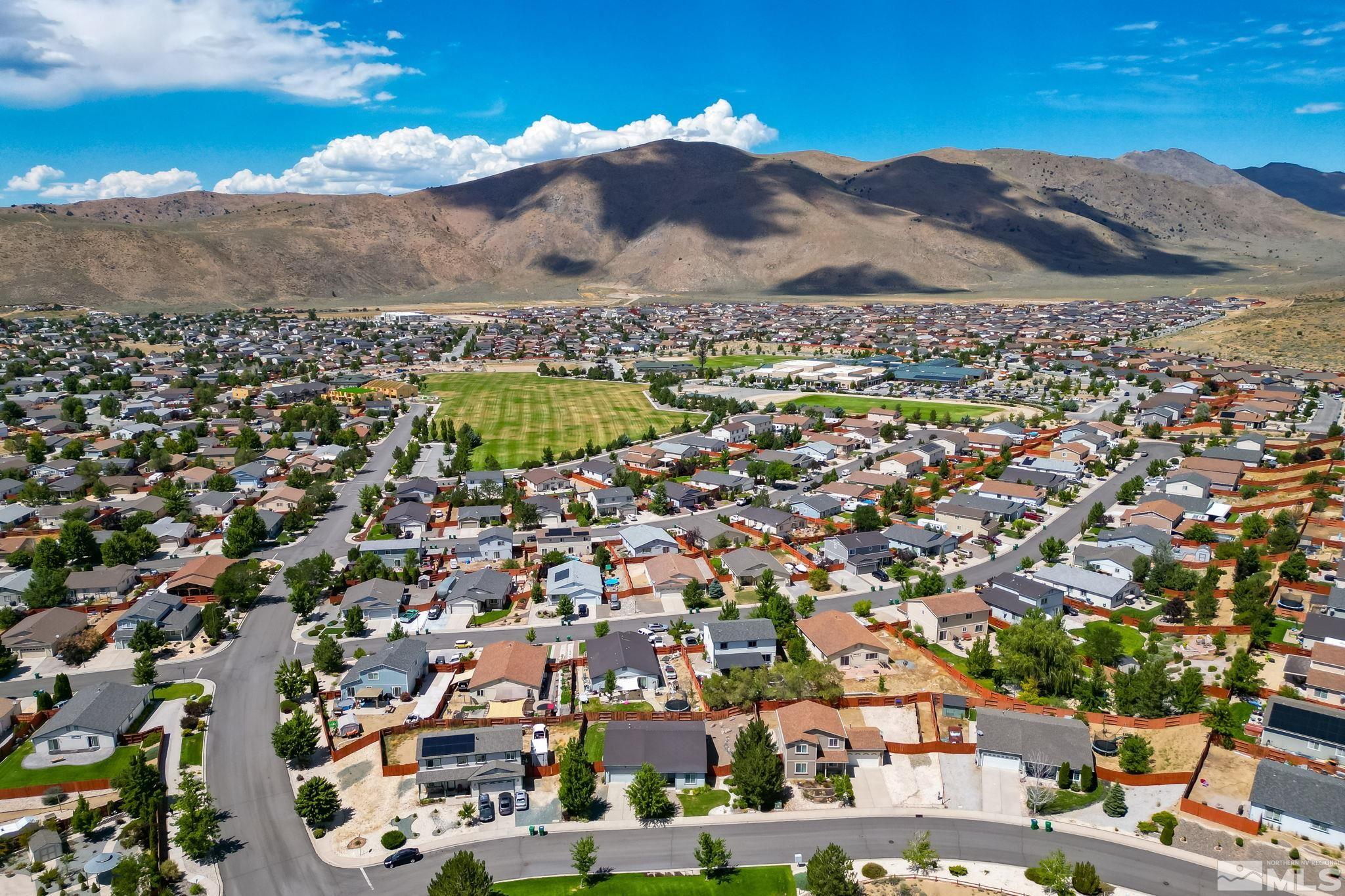 17541 Desert Lake Drive Reno, NV 89508 - Photo 31 of 33 an aerial view of residential houses with outdoor space and trees