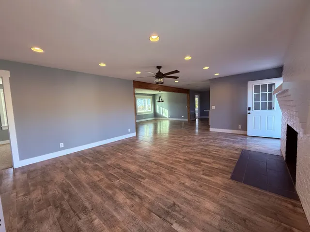 a view of an empty room with a window