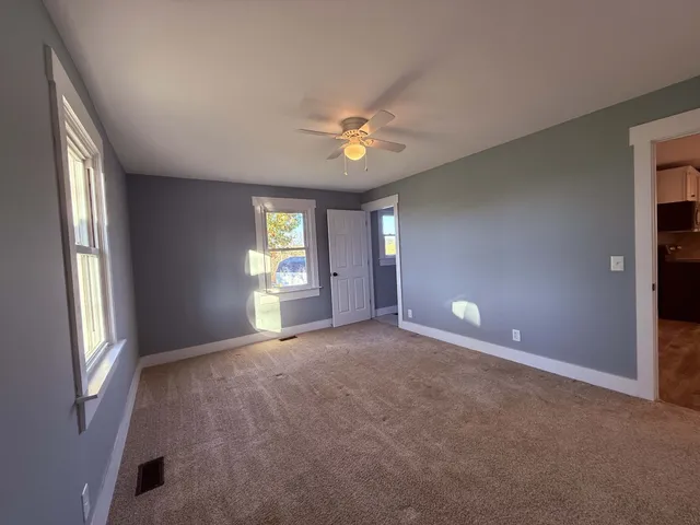 a large kitchen with stainless steel appliances granite countertop a large counter top and a stove