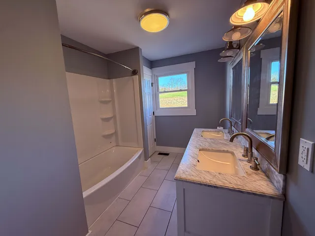 a view of empty room with windows