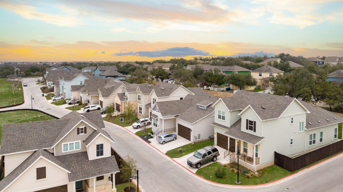 600 C-Bar Ranch Trail, Unit 136 Cedar Park, TX 78613 - Photo 6 of 9 an aerial view of residential houses with outdoor space and river