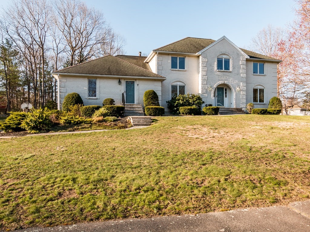 a front view of house with yard outdoor seating and barbeque oven
