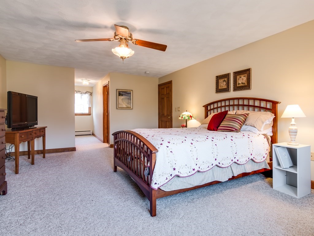 7 Old Town Road Beverly, MA 01915 - Photo 26 of 35 a bedroom with a bed and a ceiling fan
