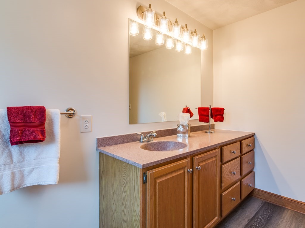 7 Old Town Road Beverly, MA 01915 - Photo 28 of 35 a bathroom with a sink and a mirror