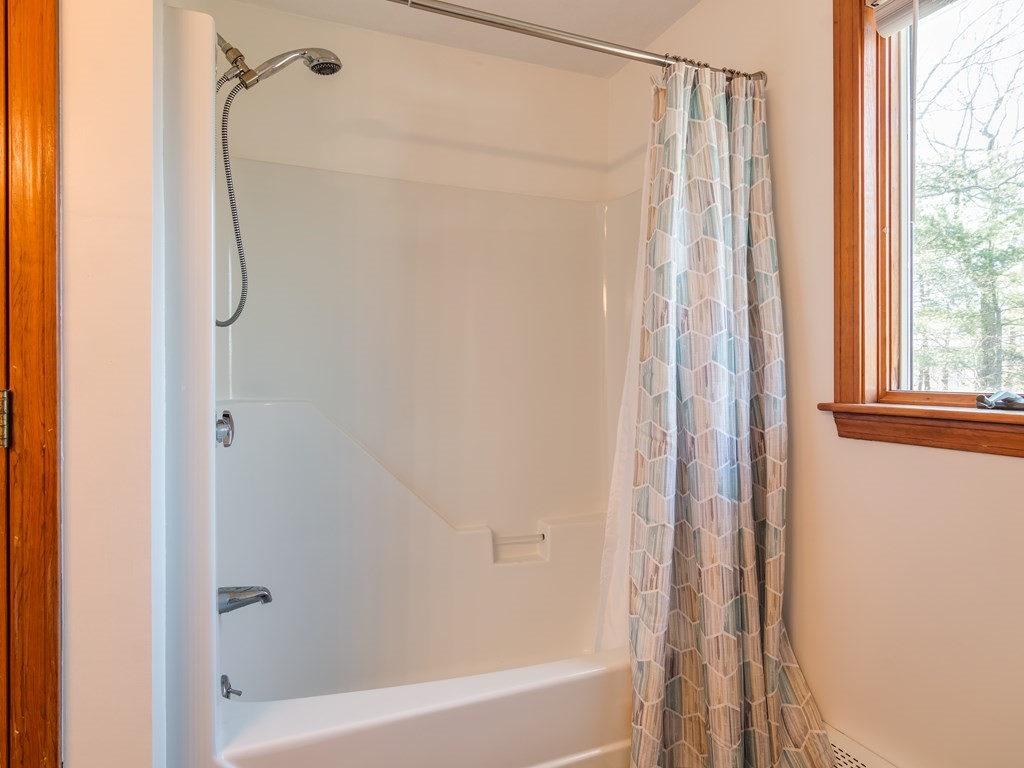 7 Old Town Road Beverly, MA 01915 - Photo 29 of 35 a bathroom with a shower and a shower curtain