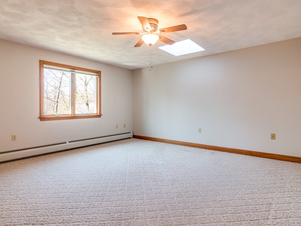 7 Old Town Road Beverly, MA 01915 - Photo 30 of 35 an empty room with a window and a ceiling fan