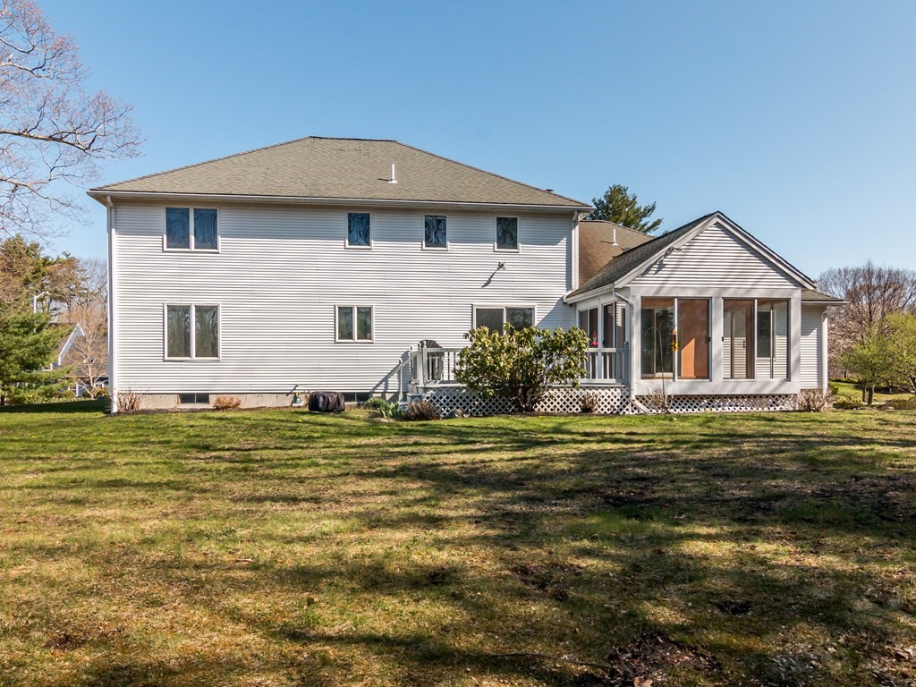 7 Old Town Road Beverly, MA 01915 - Photo 3 of 35 a front view of a house with a garden