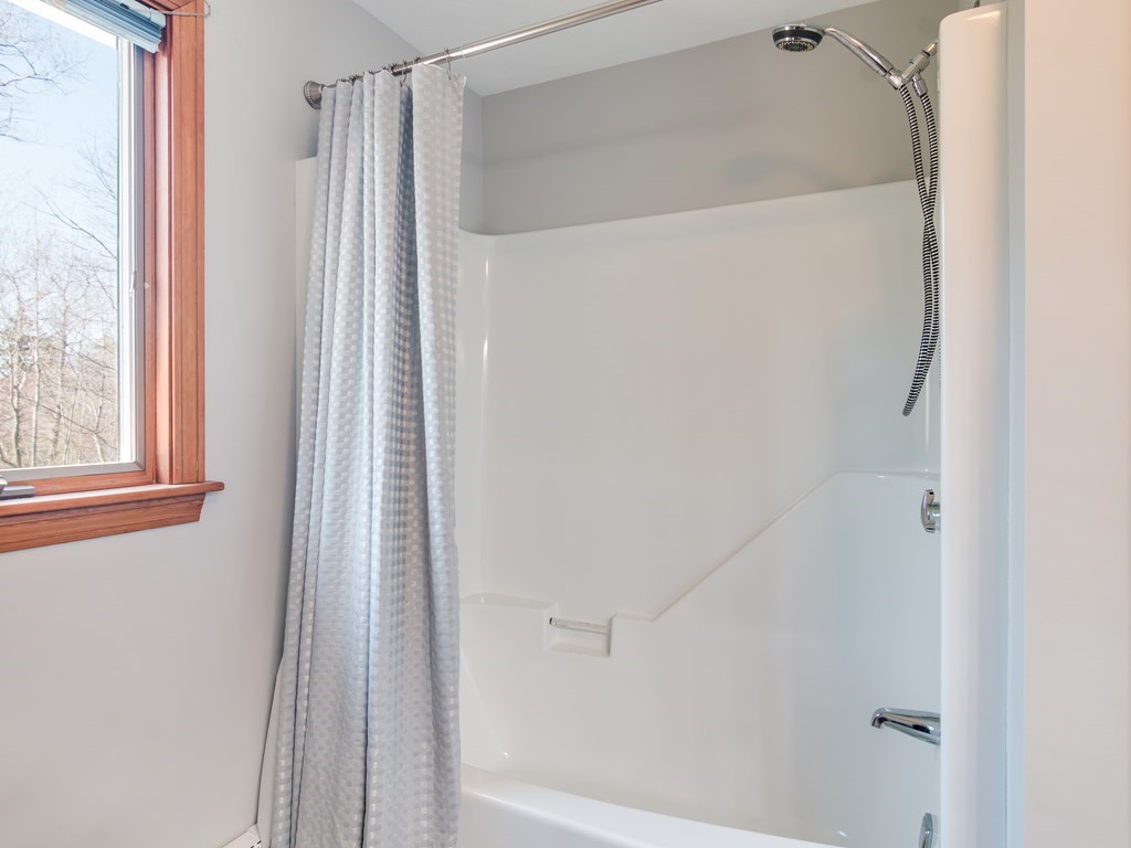 7 Old Town Road Beverly, MA 01915 - Photo 33 of 35 a bathroom with a glass shower door