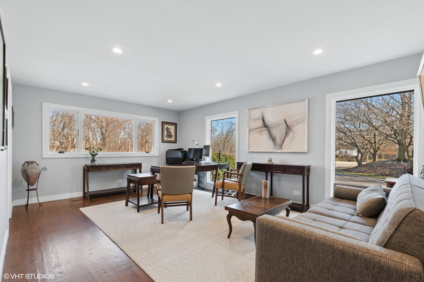 668 Sunset Ridge Road Northfield, IL 60093 - Photo 20 of 43 a living room with furniture a fireplace and large windows
