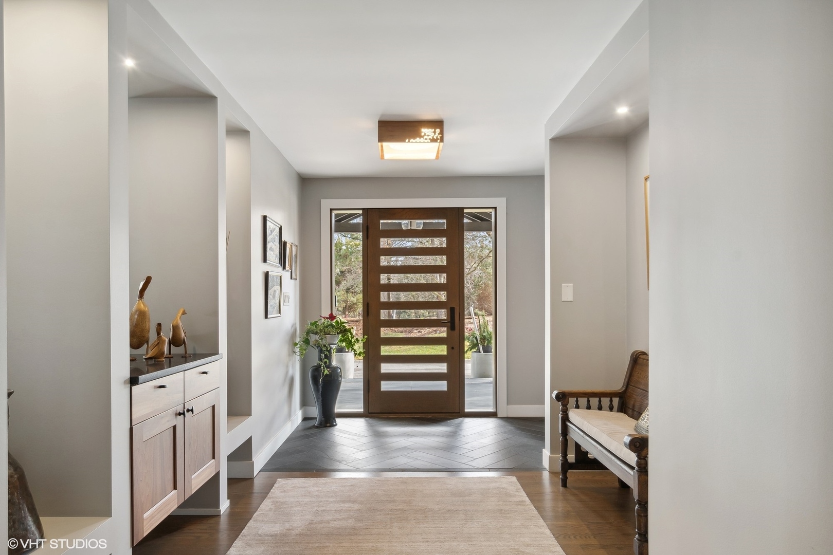 668 Sunset Ridge Road Northfield, IL 60093 - Photo 3 of 43 a view of a hallway with entryway and stairs