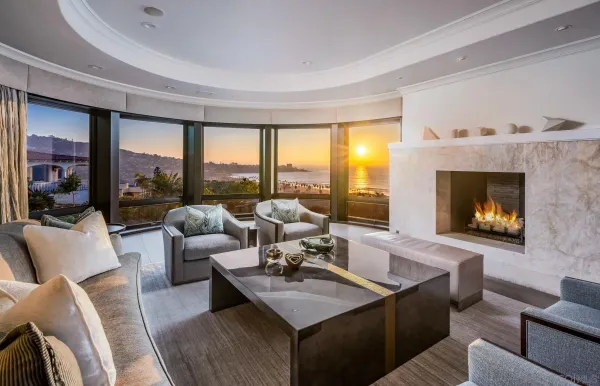 a living room with furniture flat screen tv and a large window