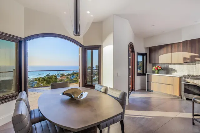 a kitchen with stainless steel appliances granite countertop a sink a stove and a refrigerator