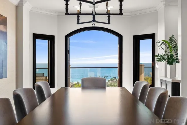 a view of a kitchen with furniture and chandelier