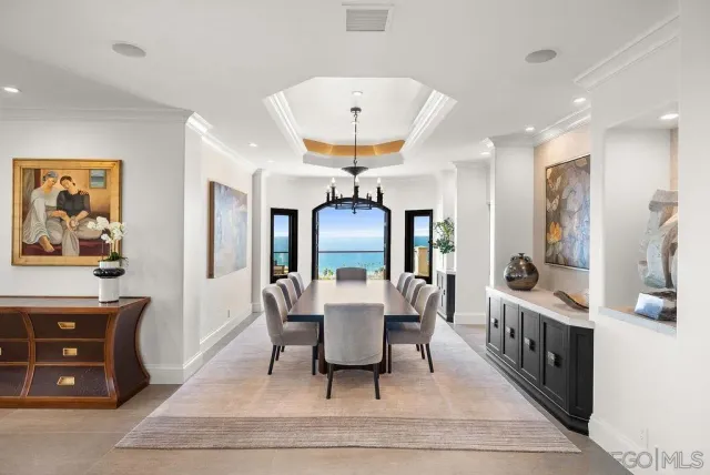 a dining room with furniture window and wooden floor